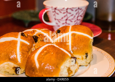 hot cross buns on plate for Easter afternoon tea Stock Photo