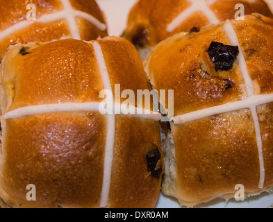 hot cross buns on plate for Easter afternoon tea Stock Photo