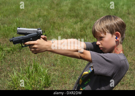 Du Bois, United States, boy aiming with two pistols Stock Photo