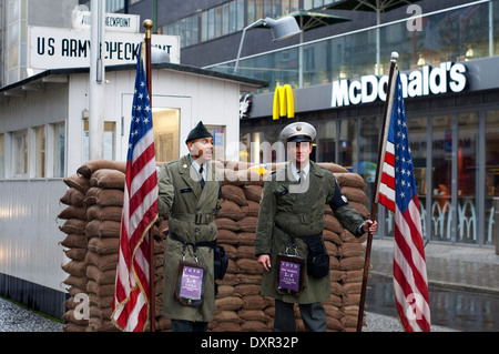 Berlin cold war Checkpoint Charlie Friedrichstrasse notorious border crossing American Soviet sectors east west wall. McDonald's Stock Photo