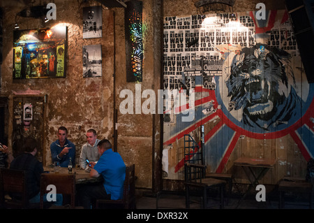 Berlin, Germany, a two-man take a beer in Zapata the Kunsthaus Tacheles. The Kunsthaus Tacheles (Art House Tacheles) was an art Stock Photo