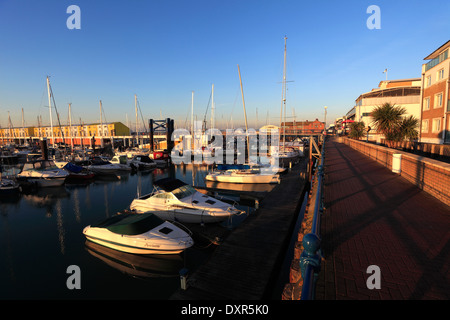 Dawn, boats and houses in Brighton Marina, Brighton & Hove, Sussex County, England, UK Stock Photo