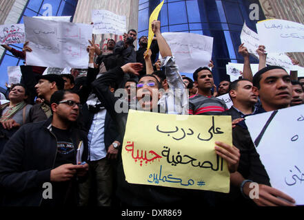 Cairo, Egypt. 29th Mar, 2014. Egyptian journalists chant slogans during a protest the death of the Egyptian journalist Mayada Ashraf, outside the Egyptian Journalist Syndicate in Cairo, on March 29, 2014. Al-Dustour, a privately-owned newspaper, said on its website that its journalist Mayada was killed while covering clashes in the northern Cairo neighbourhood of Ein Shams Credit:  Mohammed Bendari/APA Images/ZUMAPRESS.com/Alamy Live News Stock Photo