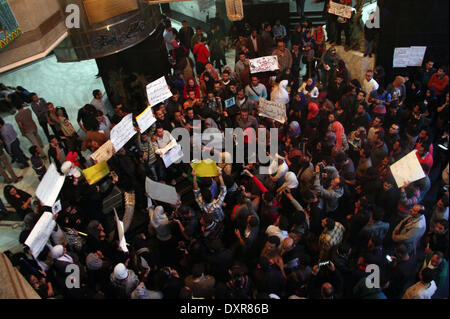 Cairo, Egypt. 29th Mar, 2014. Egyptian journalists hold banners during a protest the death of the Egyptian journalist Mayada Ashraf, outside the Egyptian Journalist Syndicate in Cairo, on March 29, 2014. Al-Dustour, a privately-owned newspaper, said on its website that its journalist Mayada was killed while covering clashes in the northern Cairo neighbourhood of Ein Shams Credit:  Mohammed Bendari/APA Images/ZUMAPRESS.com/Alamy Live News Stock Photo