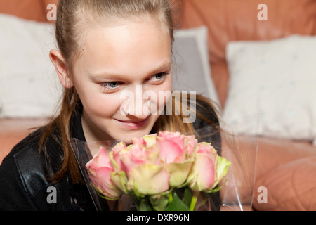 happy girl with a bunch of flowers Stock Photo