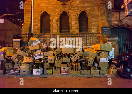 Cardboard boxes bundled for recycling outside a church in the Chelsea neighborhood of New York Stock Photo