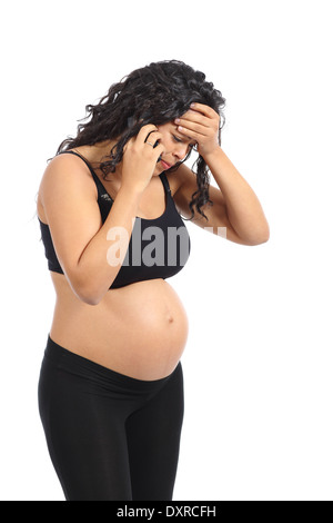 Worried pregnant woman talking on the phone isolated on a white background Stock Photo