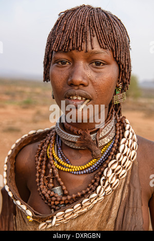 portrait of a Hamer young woman in her village near Turmi in the Omo Valley, Ethiopia Stock Photo