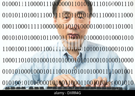Male Asian programmer with binary codes on white background Stock Photo