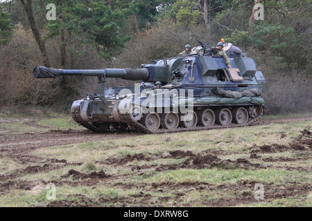 British Army AS90 TRAVELLING CROSSS COUNTRY DURING A TRAINING EXERCISE. Stock Photo