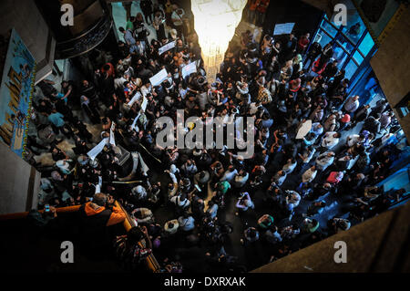 Cairo, Egypt. 29th Mar, 2014. Dozens of journalists and activists, inside the lobby of the Journalists' Syndicate, on Saturday evening, to condemn the killing of Mayada Ashraf, working on liberated newspaper Â«DoustorÂ», during coverage of the clashes between demonstrators belonging to MB and security forces. Journalist who died amid Friday clashes between police and Muslim Brotherhood supporters was killed by a gunshot wound to the head, according to forensics official Hisham Abdel Hamid. 22 year-old journalist Mayada Ashraf, who was killed during clashes between Egyptian police and Muslim B Stock Photo