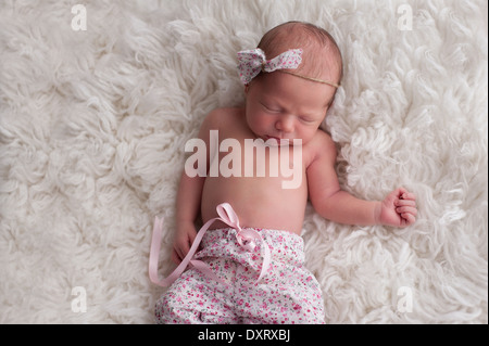 Ten day old sleeping newborn girl Stock Photo