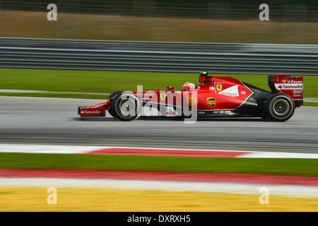 Sepang, Malaysia. 30th Mar, 2014. Ferrari driver Kimi Raikkonen of Finland drives during the Malaysian Formula One Grand Prix at Sepang International Circuit in Sepang, Malaysia, March 30, 2014. Credit:  Chong Voon Chung/Xinhua/Alamy Live News Stock Photo