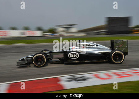 Sepang, Malaysia. 30th Mar, 2014. McLaren driver Jenson Button of Britain drives during the Malaysian Formula One Grand Prix at Sepang International Circuit in Sepang, Malaysia, March 30, 2014. Credit:  Chong Voon Chung/Xinhua/Alamy Live News Stock Photo