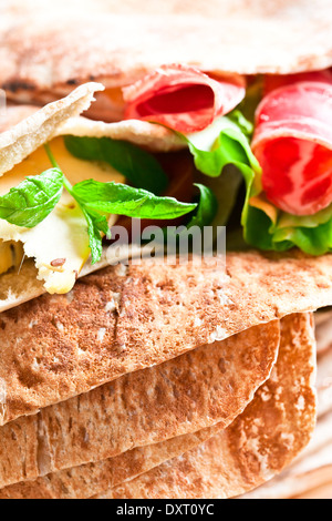 oriental bread with smoked meat and greens. Stock Photo