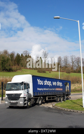 A Tesco truck entering a roundabout in Coulsdon, Surrey, England Stock Photo