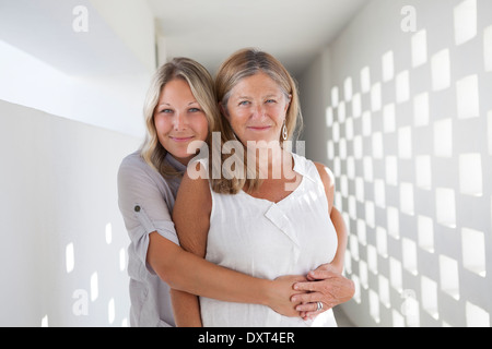Portrait of mother and daughter hugging Stock Photo