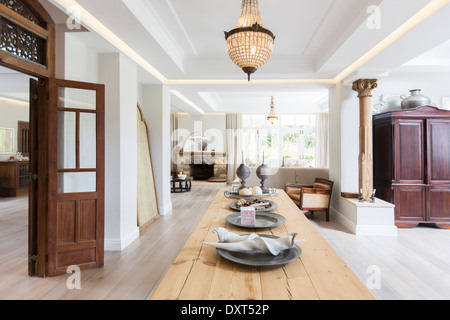 Wooden table in luxury dining room Stock Photo