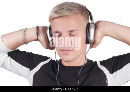 Young blond man in headphones with closed eyes Stock Photo