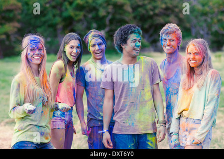 Portrait of friends covered in chalk dye Stock Photo