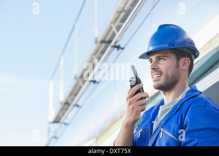 Worker using walkie-talkie Stock Photo