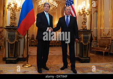 US Secretary of State John Kerry and Russian Foreign Minister Sergey Lavrov shake hands before a meeting on Ukraine March 30, 2014 in Paris, France. Stock Photo