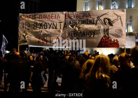 Athens, Greece, March 30th, 2014. Protesters shout slogans against the government and the omnibus bill to be voted. They staged a demonstration to protest over the omnibus bill that will result in more austerity and recession. Credit:  Nikolas Georgiou / Alamy Live News Stock Photo