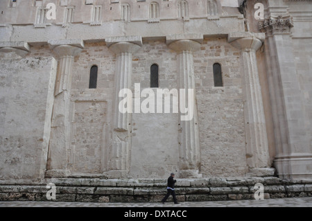 Side of the Cathedral of Syracuse, or Duomo di Siracusa, built over the  great Temple of Athena, with the original Doric columns Stock Photo