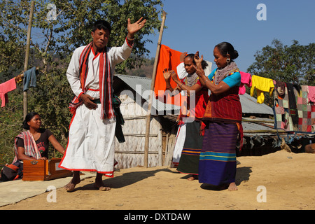 Men and women of the Tripura tribe dancing in their village in the Bandarban region of Bangladesh. Stock Photo