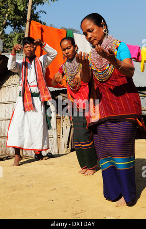 Men and women of the Tripura tribe dancing in their village in the Bandarban region of Bangladesh. Stock Photo