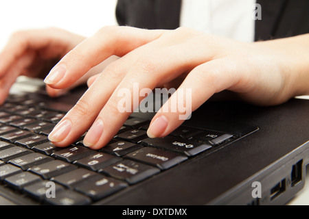 Woman hands typing on laptot, close-up, isolated over white background Stock Photo