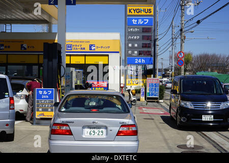 Tokyo, Japan. 3rd Mar, 2014. Business at suburban self-service gas station is brisk as drivers trying to fill up their cars at Nishi-Funabashi, east of Tokyo, on Monday, March 31, 2014, before the government levies the sales tax from the current 5% to 8% on April 1 as the country braces for its first tax hike in years.The last time Japan brought in a higher levy in 1997, it was followed by years of deflation and tepid economic growth. Credit:  Fujifotos/AFLO/Alamy Live News Stock Photo