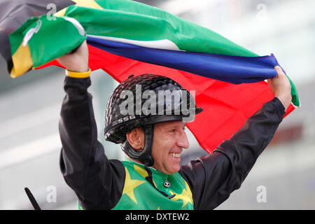 Dubai, UAE. 29th Mar, 2014. Winners presentation with a South Arfica flag waving Anton Marcus after winning the Godolphin Mile (Group 2) with Variety Club. Credit:  dpa picture alliance/Alamy Live News Stock Photo