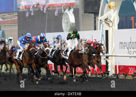 Dubai, UAE. 29th Mar, 2014. Variety Club, ridden by Anton Marcus (green-yellow) wins the Godolphin Mile (Group 2). Credit:  dpa picture alliance/Alamy Live News Stock Photo