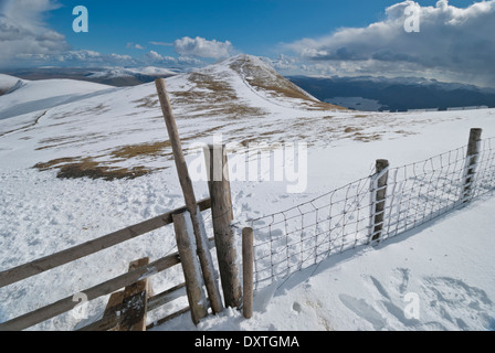 Skiddaw Lower Man in the snow with fence covered in ice, Lake District fells Stock Photo