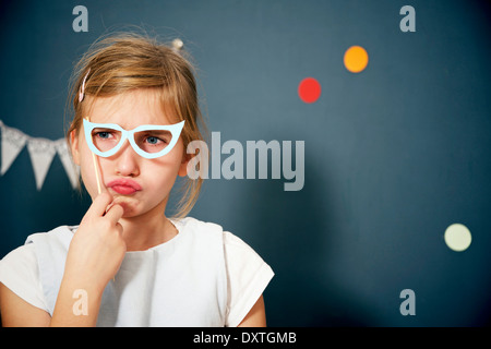 Girl in fancy dress and glasses, Munich, Bavaria, Germany Stock Photo