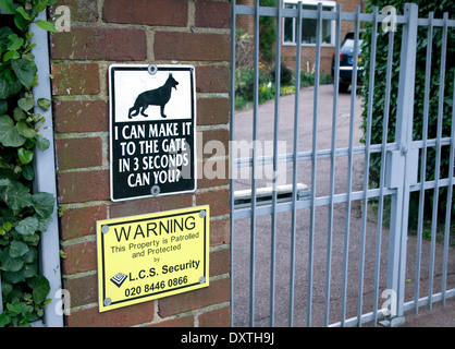 Security warning sign outside house in wealthy area of London Stock Photo