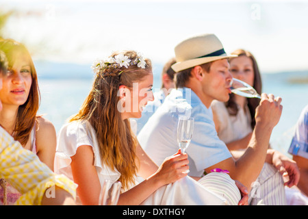 Bride and groom drinking champagne, Dalmatia, Croatia Stock Photo