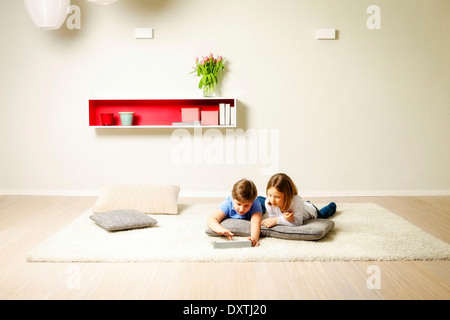 Children using computer at home, Munich, Bavaria, Germany Stock Photo