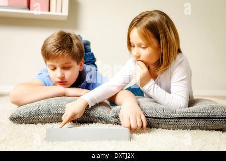 Children using computer at home, Munich, Bavaria, Germany Stock Photo