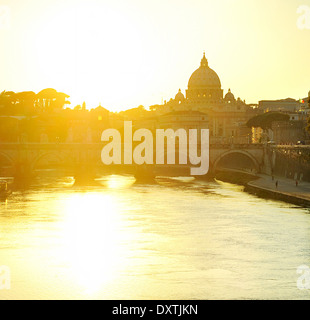 View of Tiber and St. Peter's cathedral at sunset in Rome Stock Photo