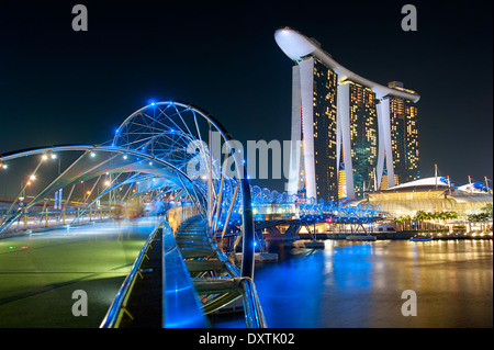 The Helix Bridge and Marina Bay Sands in Singapore. Stock Photo