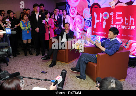 (140331) -- HANGZHOU, March 31, 2014 (Xinhua) -- In this file photo taken on Nov. 16, 2013, Alibaba's CEO Jack Ma Yun (1st R) and Intime Retail Group Co. chairman Shen Guojun (2nd R) attend an event celebrating the 15th anniversary of Intime's department stores in Hangzhou, capital of east China's Zhejiang Province. Chinese e-commerce giant Alibaba Group announced on Monday that it will pay 5.3 billion Hong Kong dollars (692 million U.S. dollars) to acquire shares of Hong Kong-listed department store operator Intime (Yintai) Retail Group Co. Under the two companies' agreement, Alibaba will acq Stock Photo