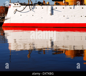 The USS Olympia stands reflective and graceful in the still waters of Penn’s Landing, City of Philadelphia Stock Photo