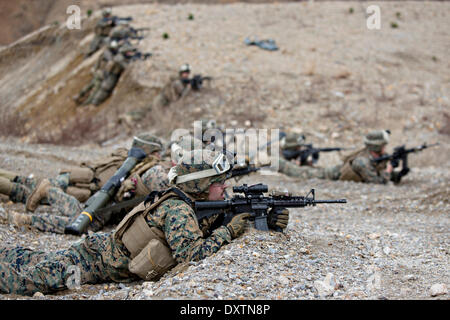 U.S. Marines take cover in a deep trench as Red mortar shell lands ...