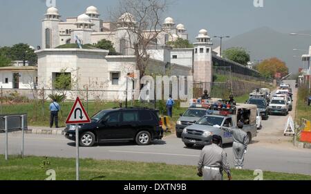 Pakistan, Islamabad. 31st Mar, 2014.  A motorcade of former Pakistani military ruler Pervez Musharraf make its way to a special court hearing a treason case  him in Islamabad on March 31, 2014. Musharraf Monday appeared in the special court which charged him with high treason -- a crime that carries the death penalty or life imprisonment. Credit:  PACIFIC PRESS/Alamy Live News Stock Photo