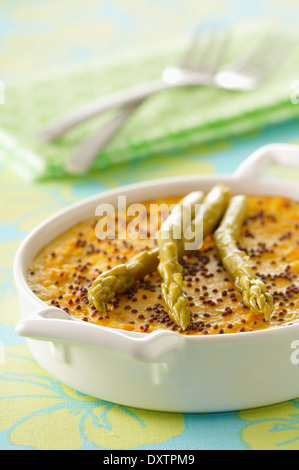Carrot Flan with asparagus and poppyseeds Stock Photo
