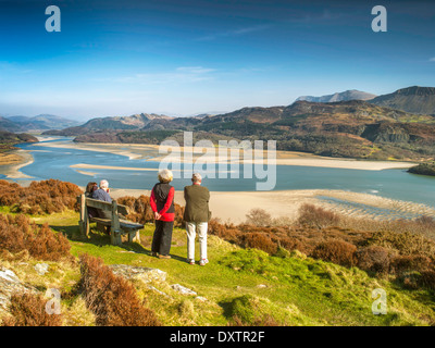 Two mature couples look over the spectacular views of the Mawddach estuary and the Cadair range from panorama walk Barmouth Stock Photo