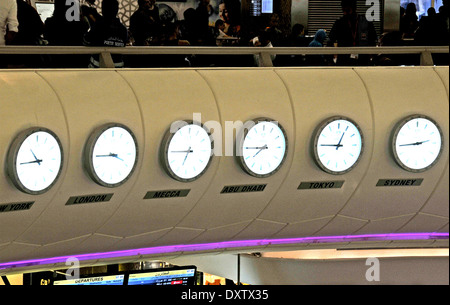 six clocks departure hall Abu Dhabi international airport Stock Photo
