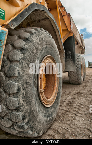 Wheels of construction vehicle on beach Stock Photo